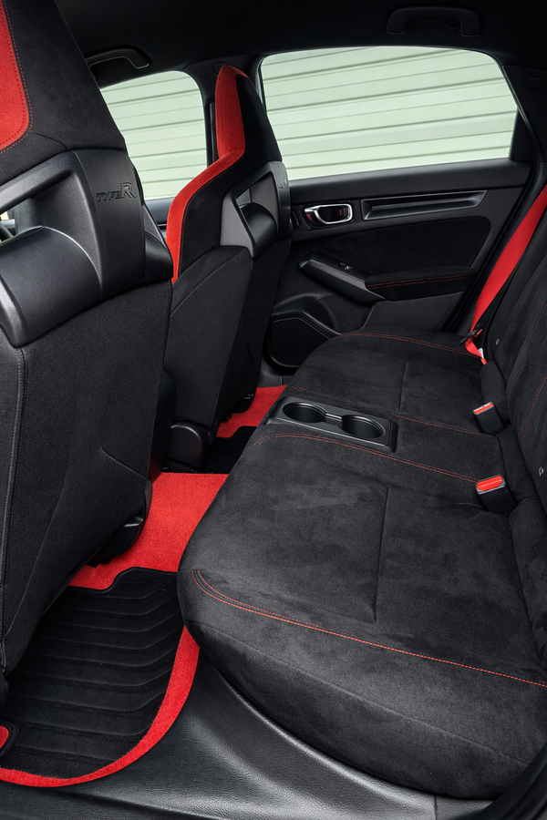 Car interior with black and red seat covers